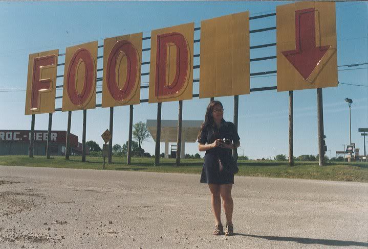 Mary Rizzo and giant food sign